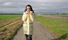 Amira in transparent Schmuddelwedda raincoat and rainpants