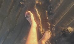 Getting my feet dirty in the wet sand