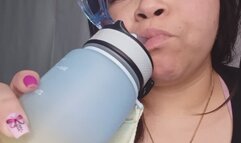 Big fat girl drinks water on a normal day