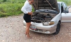 Woman pumps car pedals with high heels after repairing it (3)