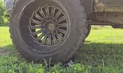Truck running over old mini fridge