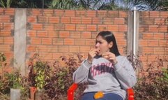 Juicy Latina Eats a Tangy Mandarin