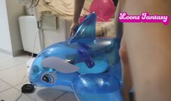 Owllete bounces on inflatable dolphin and bites it to pop it