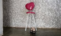 With high heels on her feet and short dress seated woman crosses her big legs (2)