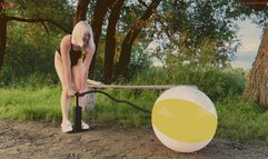 Alla pumps a new beach ball and it bursts loudly