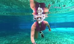 Carissa in the pink suit snorkeling in the springs and topless