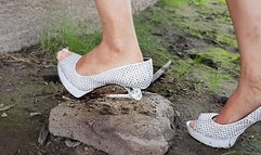 Expensive high heels at the river, high heels completely ruined, wrecked shoes, broken high heels