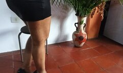 Holds stiletto heels on his feet when his legs are crossed (cC)