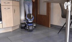 Electrical Motobike under two booted Girls