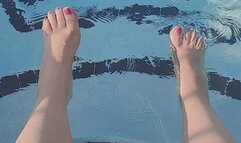 Splashing feet in pool with pink nail polish -JunieRose