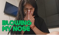 Blowing my nose with my nose red