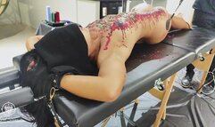 BDSM slave punished with spanking and wax play