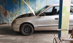 with her stiletto heels she pumping the pedals of her old car (3)