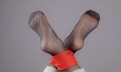 Tied Feet In Black Stockings