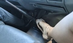 Katherine sensually playing with her flat sandals during a trip in her truck