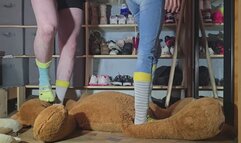 Chrissy and Dan crushing a huge stuffed toy