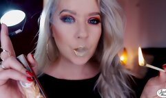 Gold lips on a black 120 cigarette [wmv]