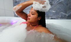 chilling in the bathtub in a bikini