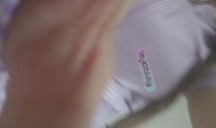 Purple school dress & drynite wearing Tinylittlebabyg playfully poses on the bed & in the mirror