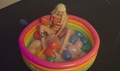 hot tatooed gril popping balloons for looners