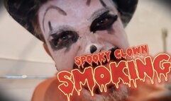 Spooky clown smoking