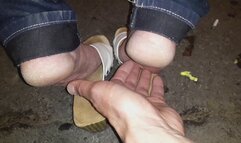 Bus stop wooden sandals bare soles tickling at public
