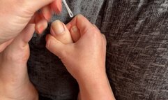 Girl cutting her toes nails