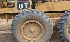 Katherine Struggling to drive a huge Caterpillar Machine