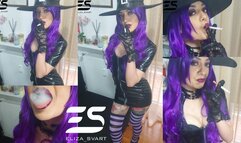 Smoking witch in a pvc dress and lace gloves