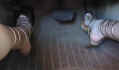 Fifi teasing and pumping the pedals before driving around in reveling gold heels that wrap up the leg