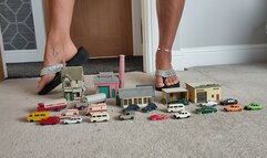 Nikkichick crushes buildings & many small cars in flip flops with painted toe nails toy cars crush close ground view