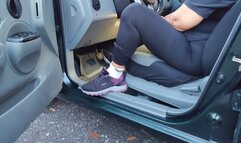 Diana Senior pedal pumping her car in socks and sneakers