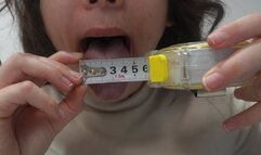 Indian stepsister measures the length and width of her tongue, then measures the width and length of her mouth with a centimeter