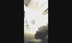 A blonde Japanese woman in cosplay gives a handjob to a masochistic man