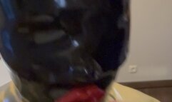 Rubbermissy selfenjoyment of a black Rubberdoll with blindfold and gag in full latex catsuit