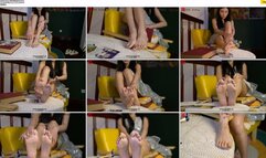 The beautiful, wealthy girl, Yi Yi, sat in a chair applying lotion to her beautiful feet and playing with her toes.