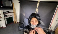 Rey bound and gagged in a shiny Downjacket and Leatherpants