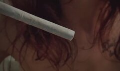 Smoking the white softened cigarette while playing with my breasts