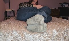 Chilling on my bed while showing off my socks and feet