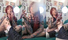 Smoking goddess enjoying a cigarette wearing converse trainers and short skirt- Kinkerbell23