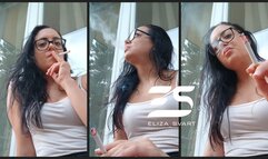 Raw and candid smoking on the balcony with messy hair and no makeup