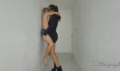 Giantess dominatrix pins small man against hallway wall