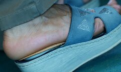 Sandals and foot fetish watching close-up, hot foot heels, the feet move continuously in an attractive way