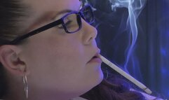 Sitting close in profile wearing my white halter, holding a VS 120 in my mouth