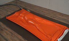 Adventurer finds herself trapped in an orange vacuum bag orgasm
