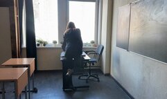 The teacher gave the test to the students and while they were doing it, the teacher was playing with her shoes