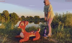 Alla tightly inflates the inflatable Bambi with a hand pump