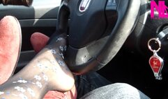 Footsie in the car in black floral pantyhose