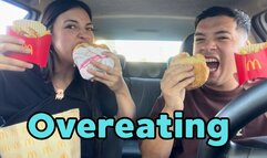 Eating a huge burger in the car
