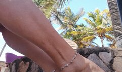 Magnificent feet with pronounced arches modeled on a beach (1)